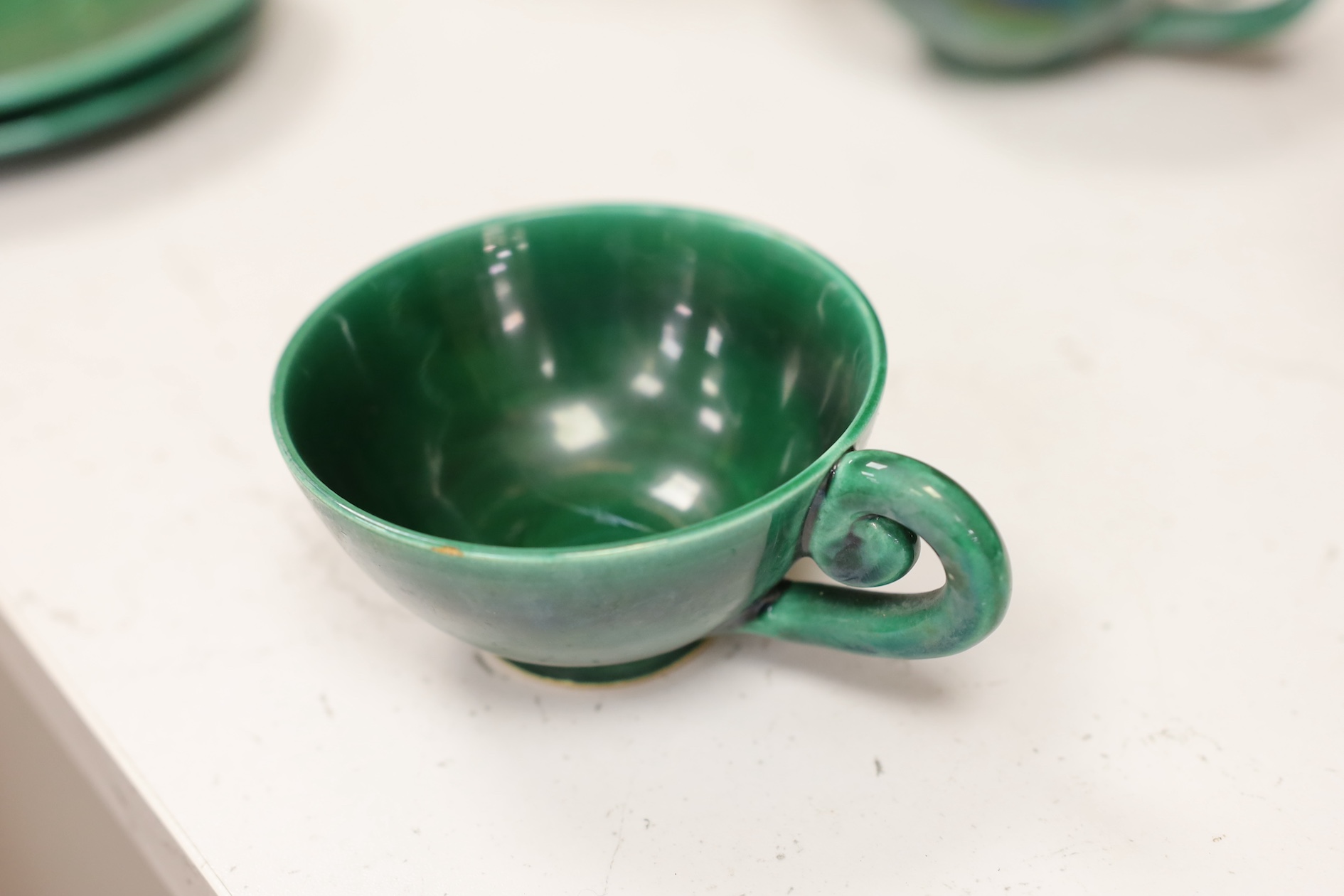 A Vallauris French bright green tea service, with six cups saucers milk jug and tea pot, jug 12.5cm high. Condition - fair to good